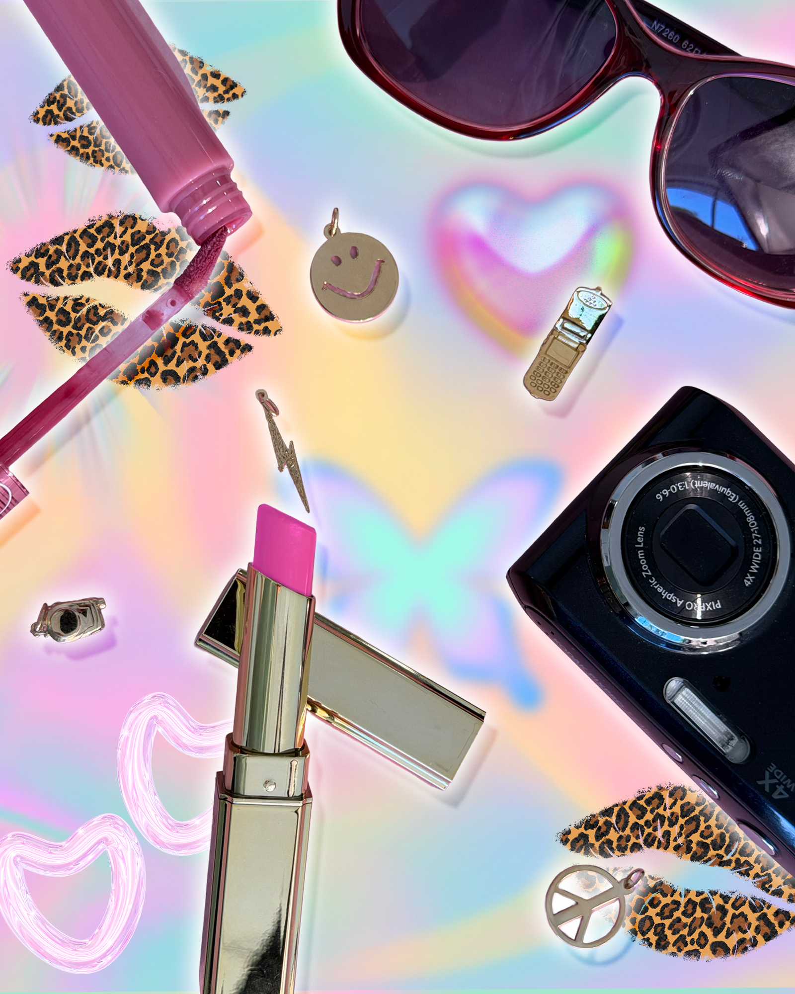 Smiley face, flip phone, lightning bolt and peace sign charms beside pink lip gloss, lipstick, sunglasses and a digital camera on an iridescent backdrop